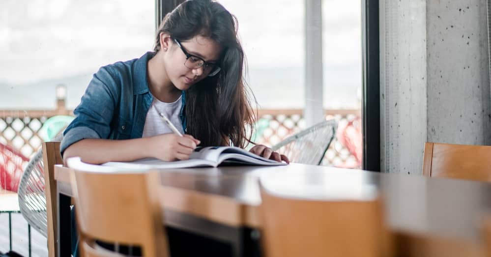 Young woman studying to improve SAT score
