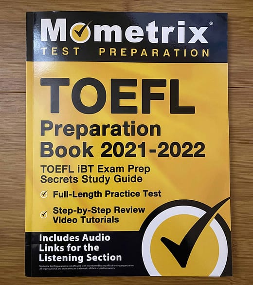 Mometrix Test Preparation TOEFL Preparation Book 2021 - 2022 on a table